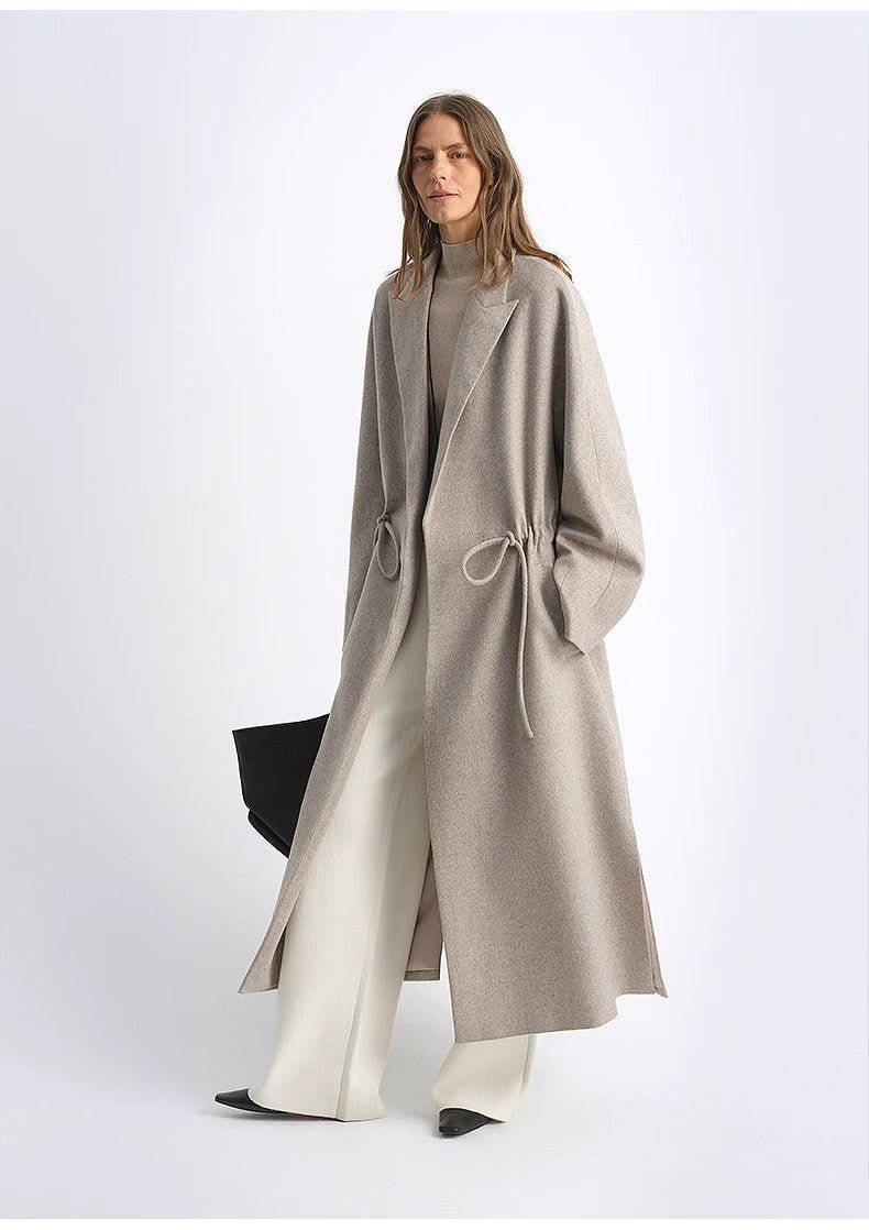 Women's wool coat by Firelady Fur with peaked lapel, drawstring waist, in desert heart color, mid-length, stylish and warm.