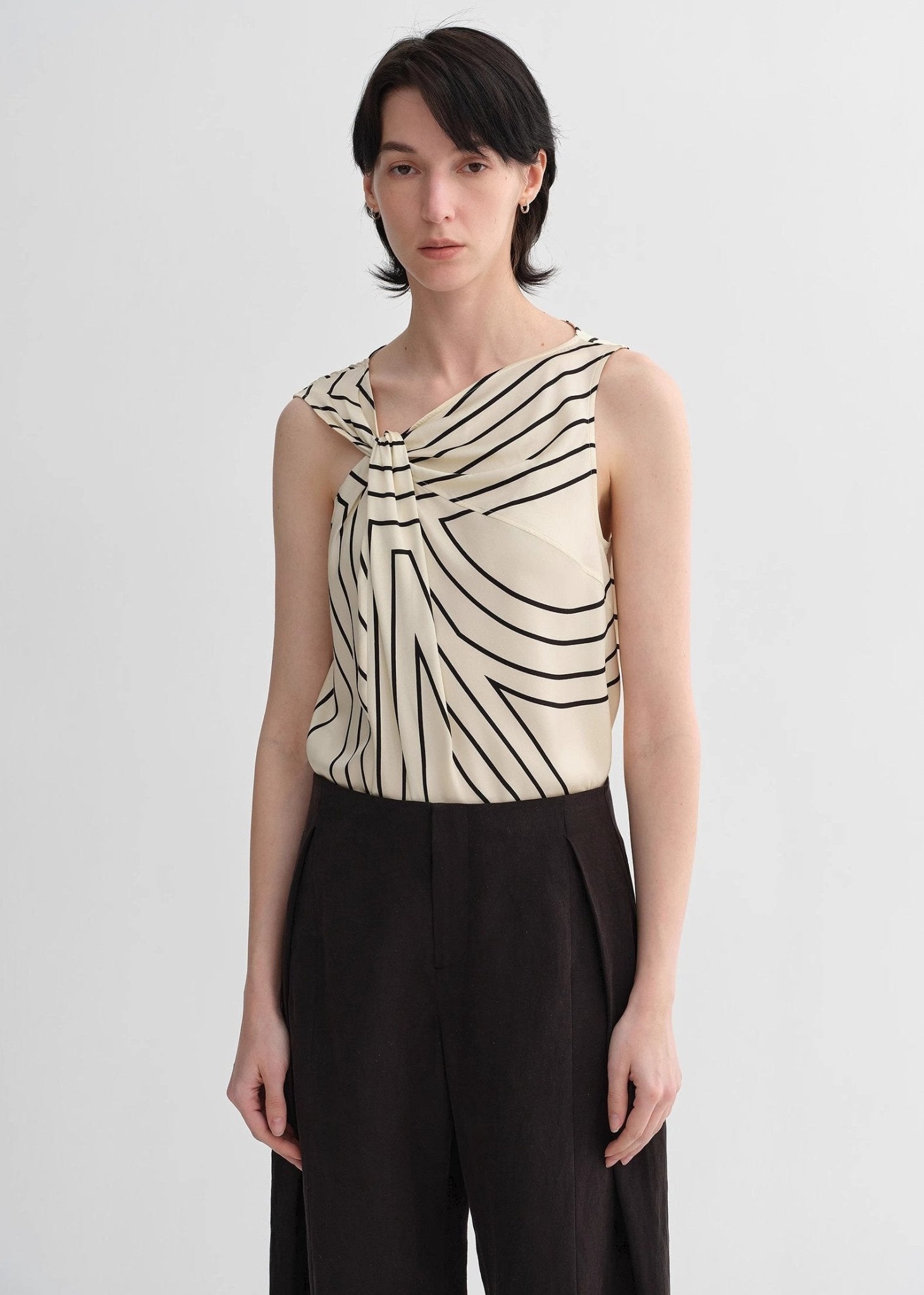 Silk sleeveless shirt by Maison Élvorain with twisted collar and geometric print, slim fit top for women.