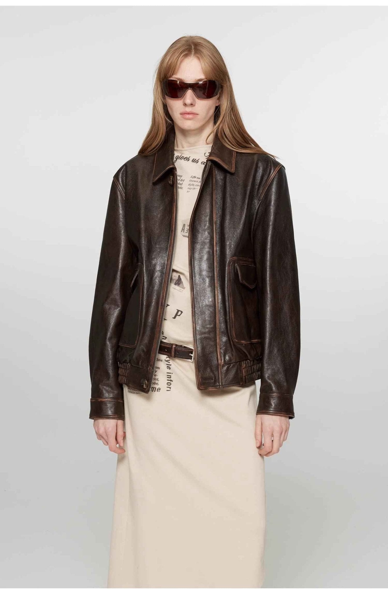 Vintage brown leather jacket for women by Firelady Fur, aviator style with classic leather detailing.