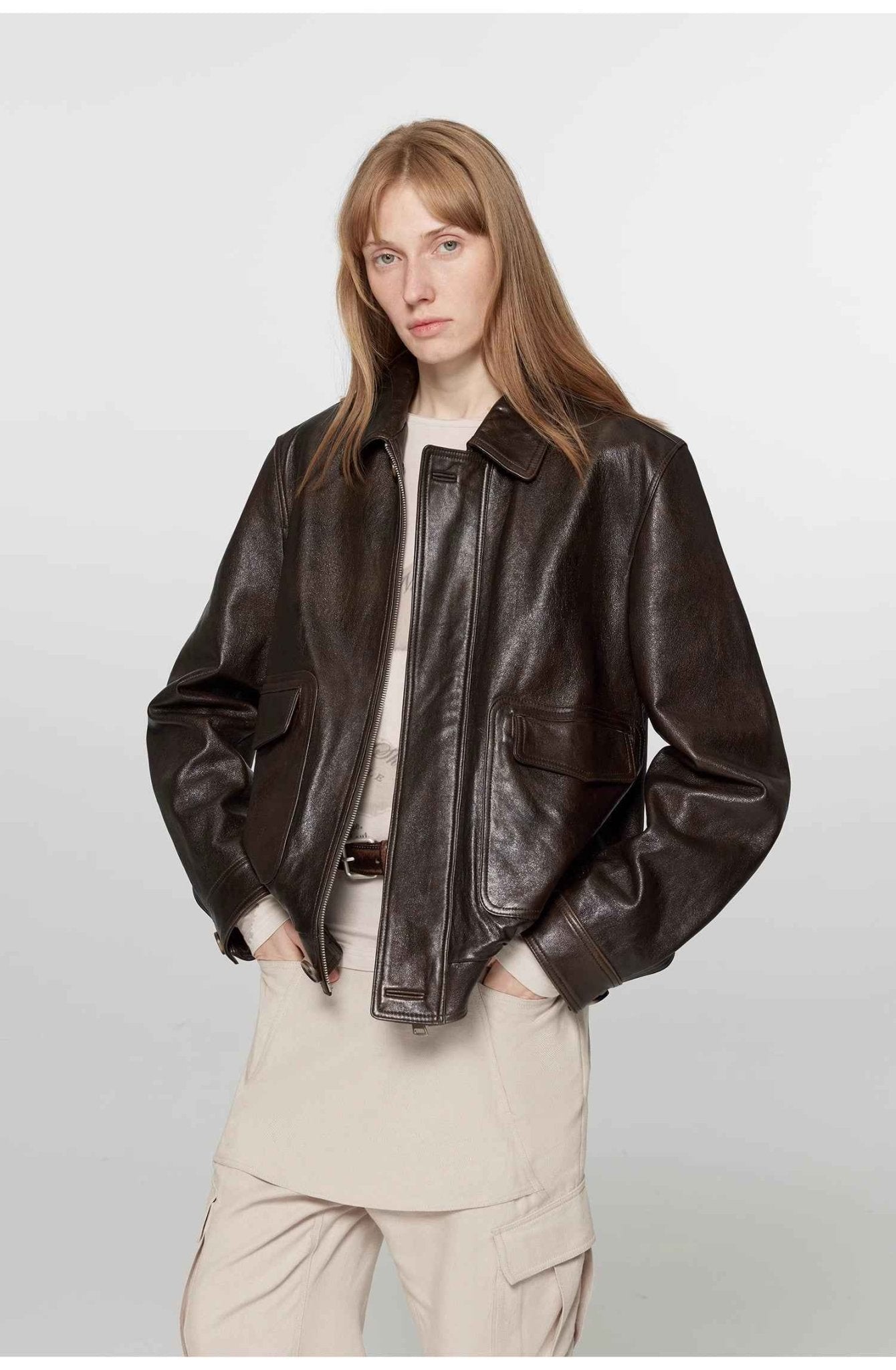 Vintage brown leather jacket for women by Firelady Fur, aviator style with classic design and detailed stitching.