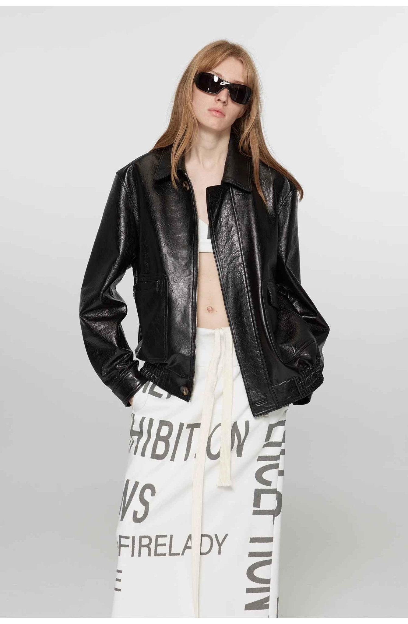 Vintage brown leather jacket for women by Firelady Fur, aviator style with classic detailing and a timeless design.