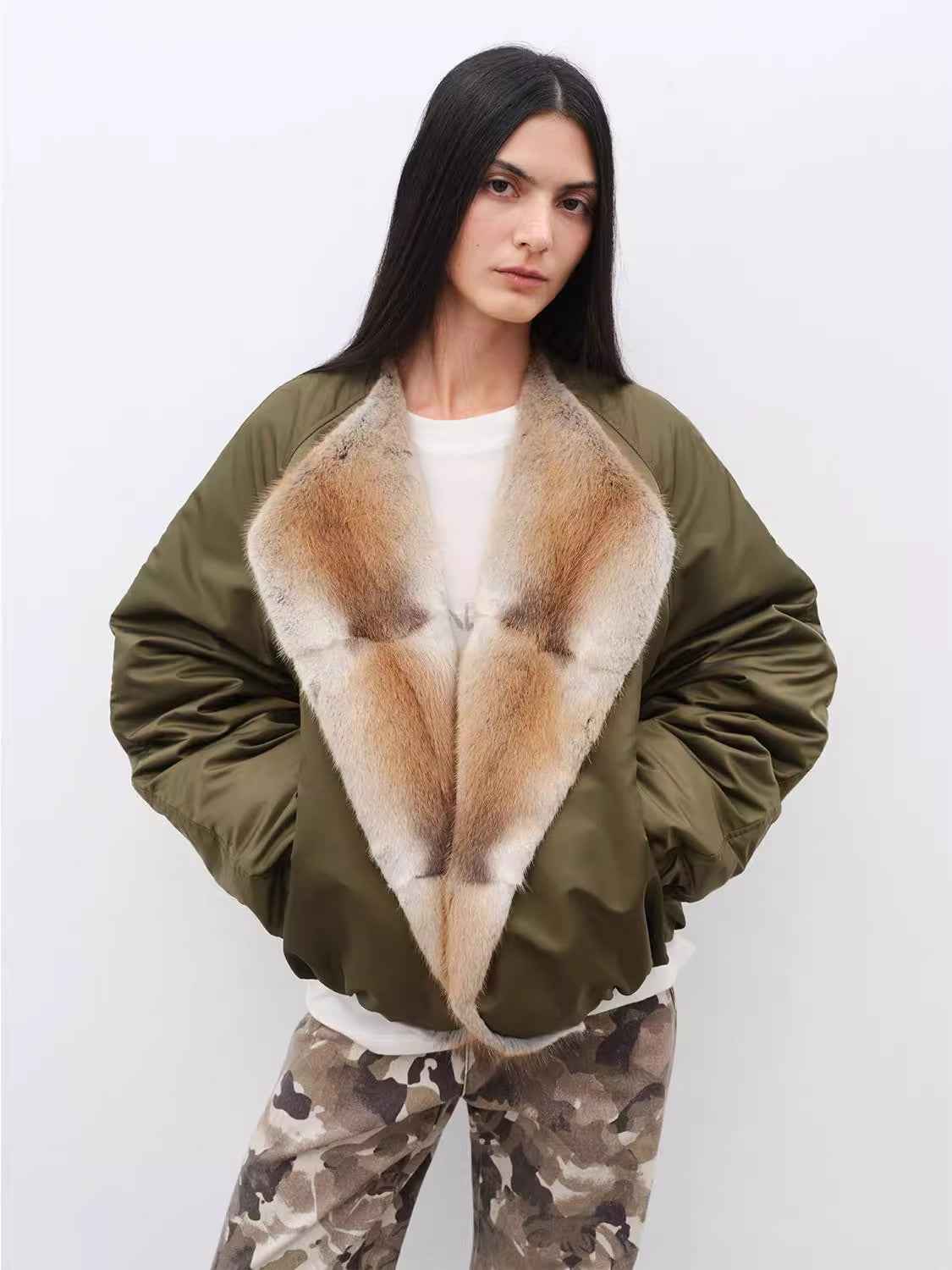 Women's colorblock parka by Firelady Fur featuring a sable muskrat fur collar and goose down filling.