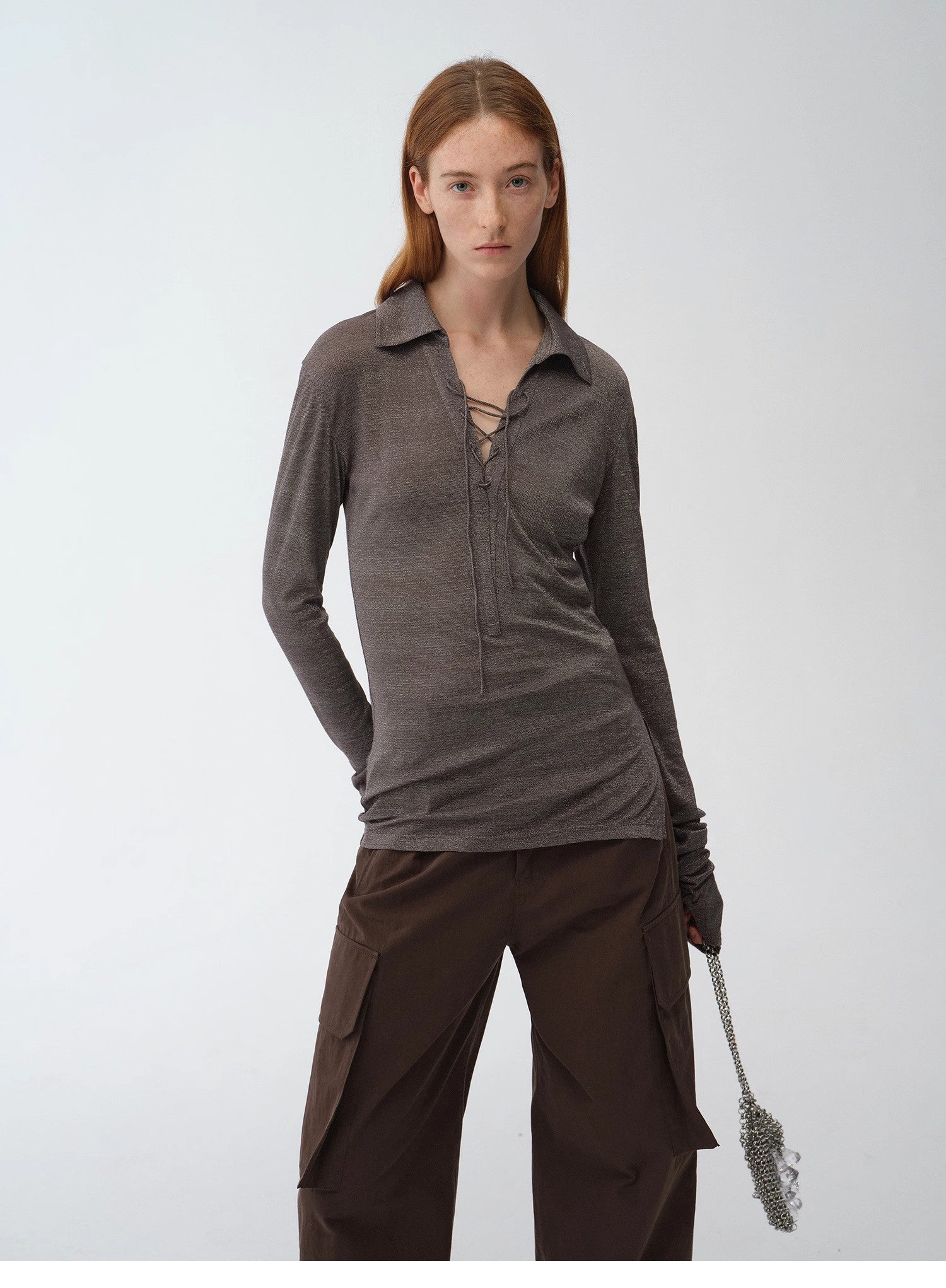 Light silver silk knitted top by Firelady Fur featuring a tie lapel, slim fit, long sleeves, and a slightly transparent draped design.