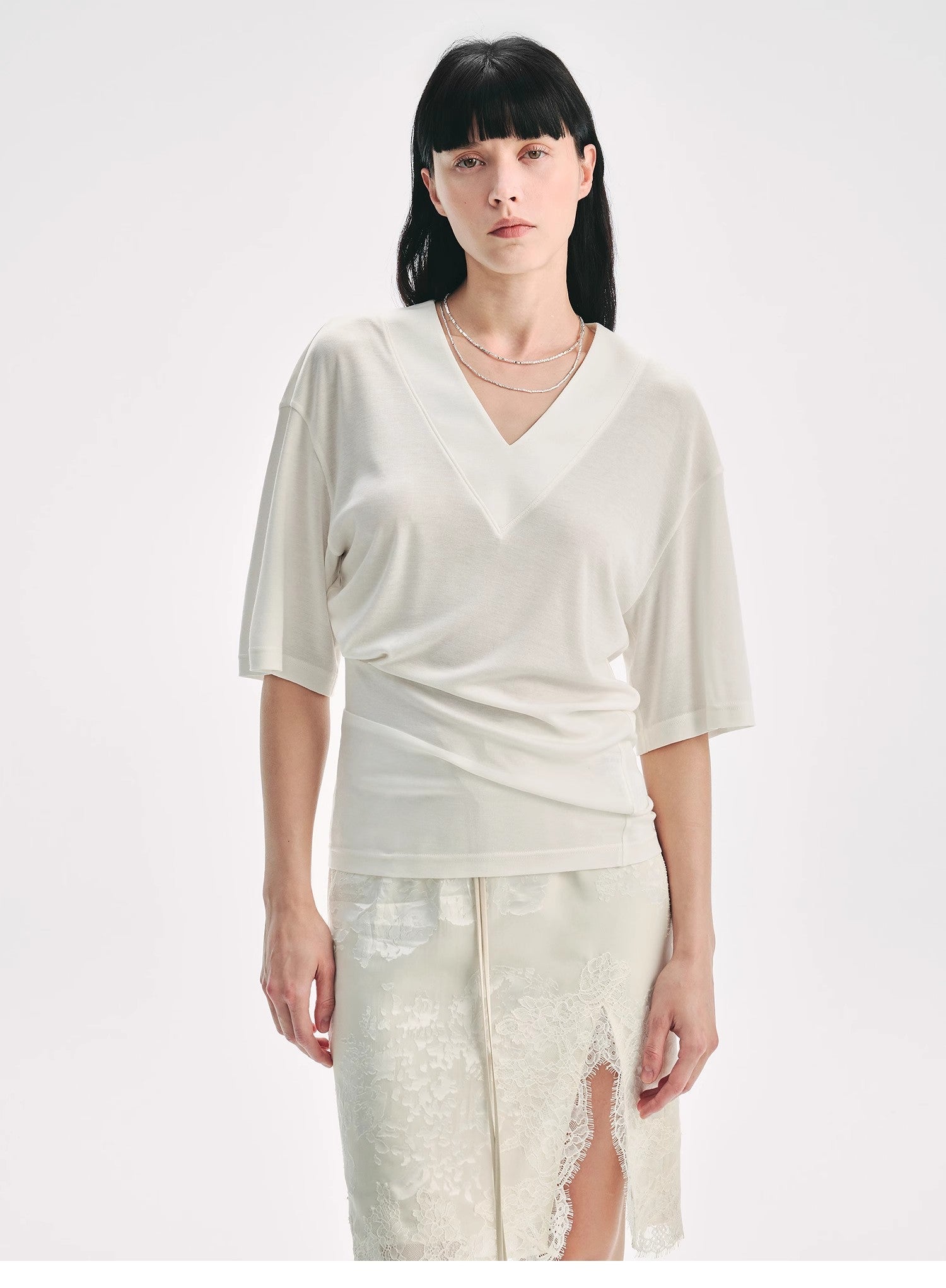 Firelady Fur silk Tencel V-neck pleated women's T-shirt with loose fit and dropped shoulders, shown with a stylish bag.