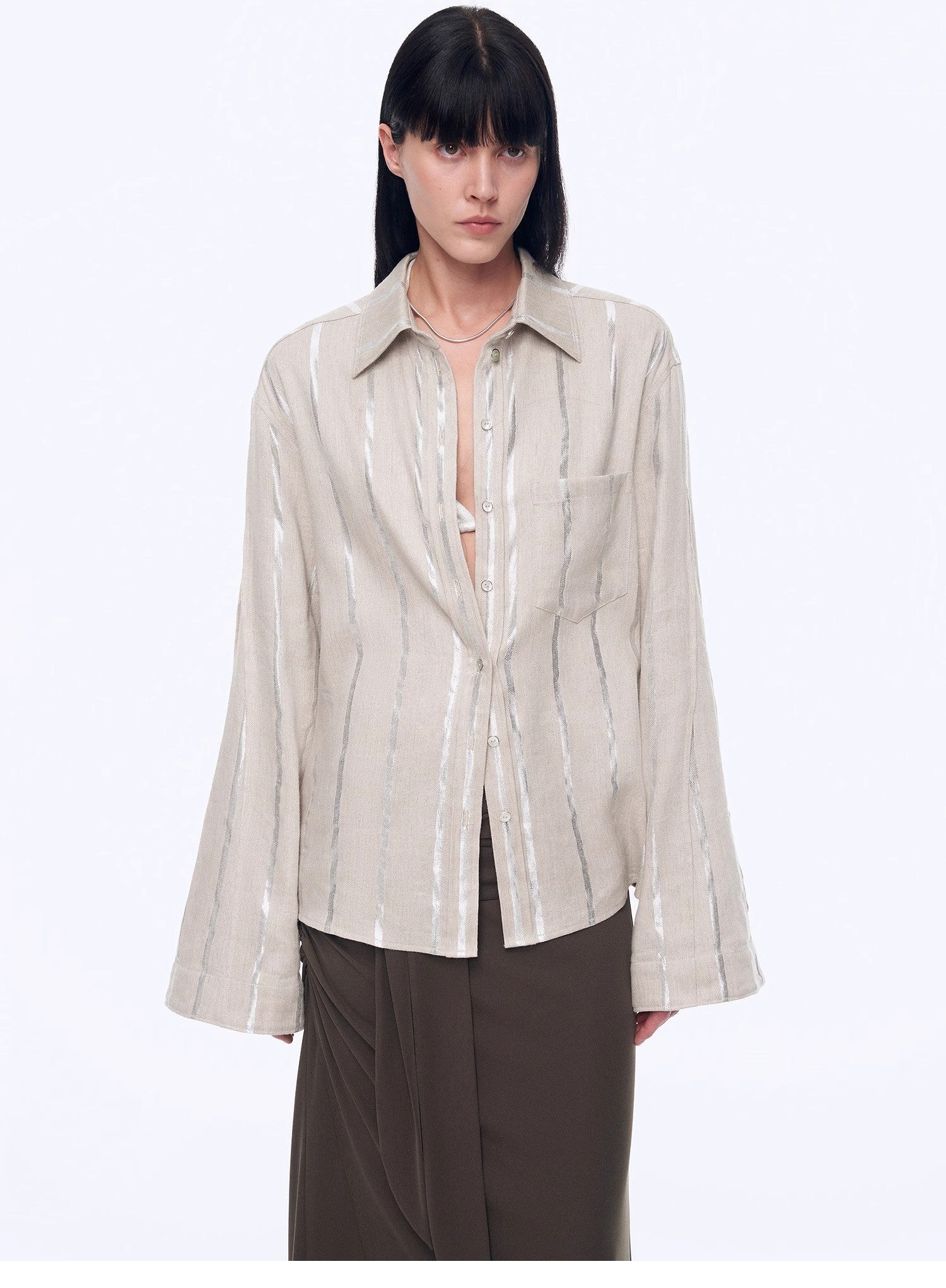 Silver-striped linen cropped shirt with trumpet sleeves from Firelady Fur, styled as a fashionable top by Maison Beaumont.